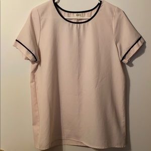 Light pink blouse with black neck and sleeve trim
